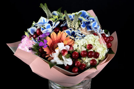 Fragment of bouquet of different flowers. Floral close-up, background and texture. The bright colors of natureの写真素材