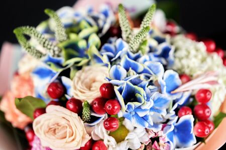 Fragment of bouquet of different flowers. Floral close-up, background and texture. The bright colors of natureの写真素材