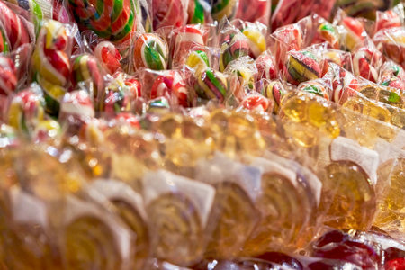 Lots of multicolored sweet lollipops candy. Background close upの写真素材