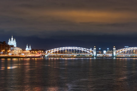 Smolny Cathedral and Peter the Great Bridge over the Neva River. Russia, Saint Petersburg, night city landscapeの写真素材
