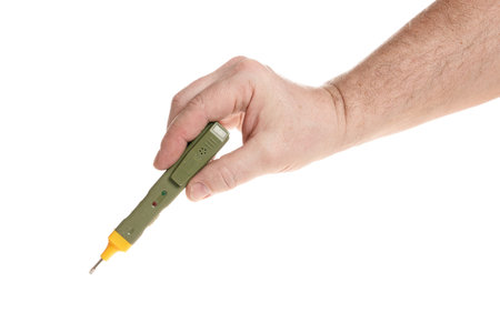Hand holds a probe detector of electrical wiring on a white background, template for designers.