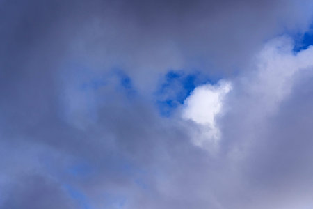 Cumulus clouds on blue sky, background of white clouds on the sky. ... Weather phenomenon in the...