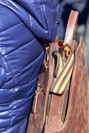 St. George ribbon tied on a bag, a symbol of memory and heroism. Close up