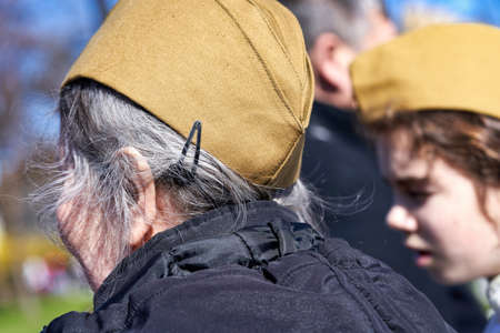St. Petersburg, Russia - May 09, 2021: Portrait of an old woman with gray hair in a military garrison cap on Petersburgのeditorial素材