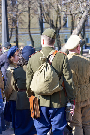 Saint Petersburg, Russia - May 09, 2021: A soldier with duffel bag at the Victory Day party on the...