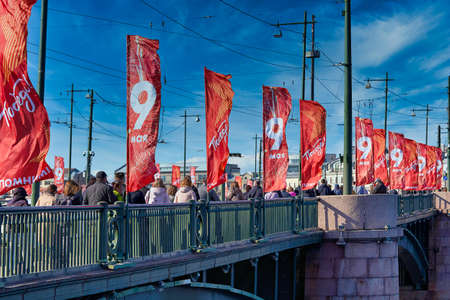 Saint Petersburg, Russia - May 09, 2021: People walk across the bridge decorated for Victory Day in St. Petersburgのeditorial素材