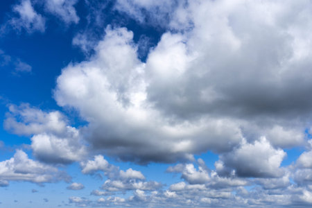 White cumulus clouds on blue sky background, natural phenomenon background and texture