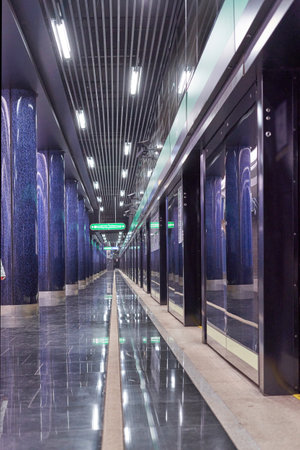 Fragment of an underground metro station with marble columns. Vertical shotのeditorial素材