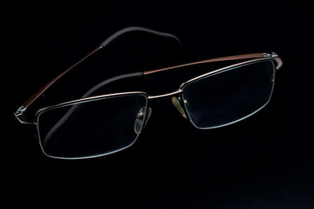 Glasses in fashionable frames on a black backgroundの写真素材