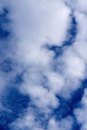White cumulus clouds on blue sky background, natural phenomenonの写真素材