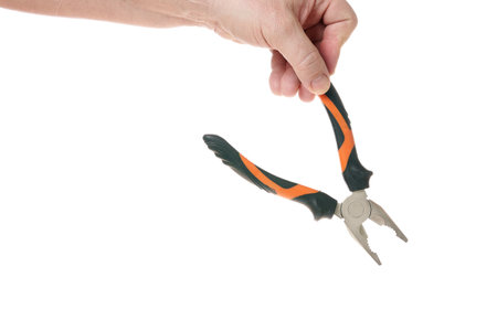 Hand holds pliers on a white background, a template for designers.の写真素材