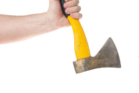 Hand holds an ax with a yellow handle on a white backgroundの写真素材