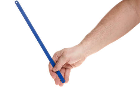 Hand holds a hacksaw blade for metal on a white backgroundの写真素材