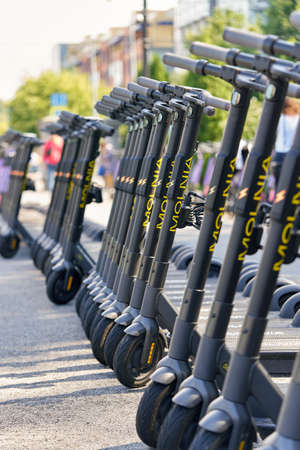 Saint Petersburg, Russia - August 08, 2021: Rental electric scooters in a shared parking lot in the city park in Petersburgのeditorial素材