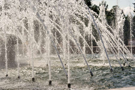 Fragment of a city fountain with water jets and splashes. Water fountainの写真素材