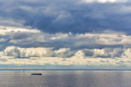 Marine skyline with dark storm clouds and smooth water. Sea at Huahinの写真素材