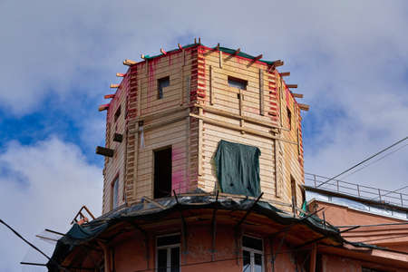 Wooden superstructure in the form of a tower over a brick buildingの写真素材
