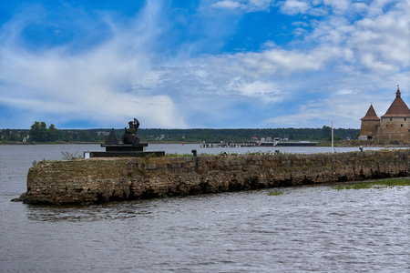 Saint Petersburg, Russia - August 09, 2021: monument to the beacon in shlisselburg, a man turns on the lights on the riverのeditorial素材