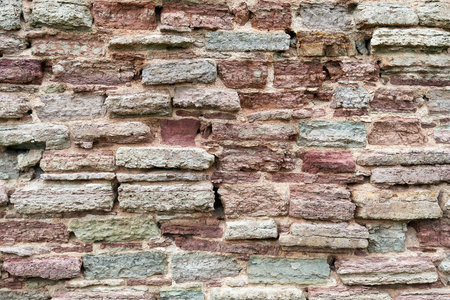 Old red brick wall. Background from destroyed brick wall