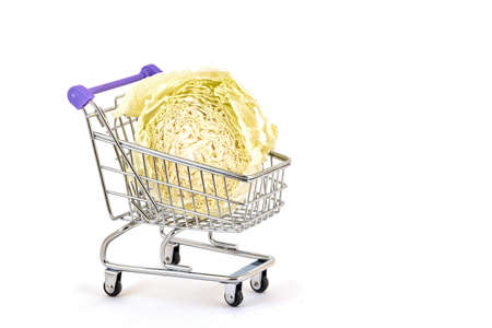 Cabbage in a supermarket trolley on a white backgroundの写真素材