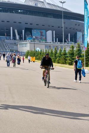 People walk near Zenit Stadium during Euro 2020 championship in St. Petersburgのeditorial素材