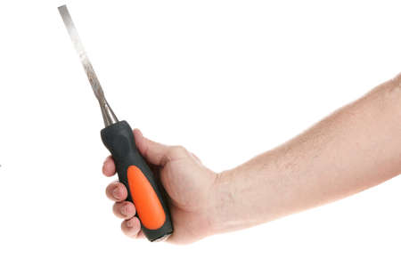 Hand holds a chisel on a white background, template for designers.の写真素材