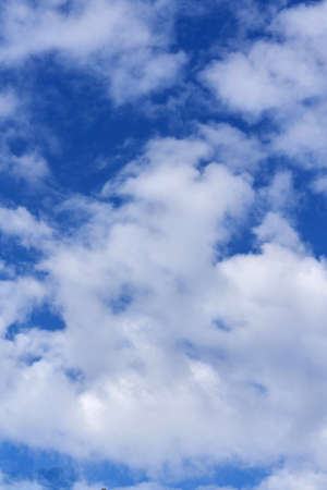 White cumulus clouds on blue sky background, natural phenomenonの写真素材