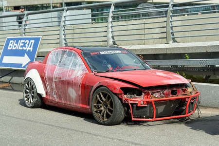 Broken red racing car after an accident in Petersburgのeditorial素材