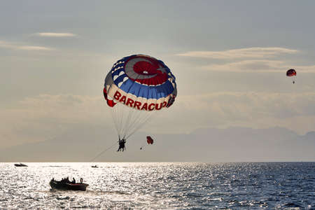 Parachute over the sea, resort water activities. Extreme vacation by the seaの写真素材
