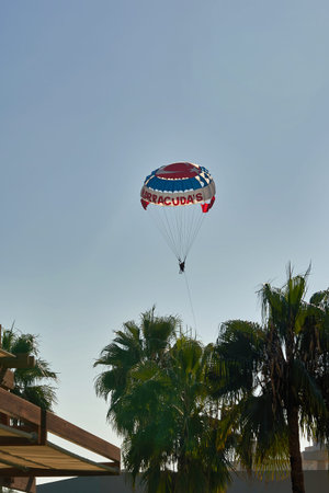 Parachute over the sea, resort water activities. Extreme vacation by the sea