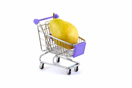 Ripe pear in a supermarket trolley on a white backgroundの写真素材