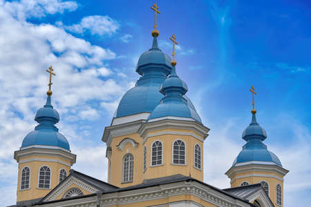 Fragment of the bell tower of a Christian church with a blue roofの写真素材