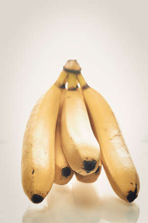 Bunch of ripe yellow bananas on white backgroundの写真素材