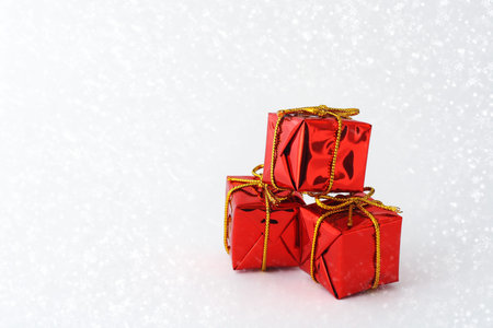 Gift boxes in snow and with decoration 
