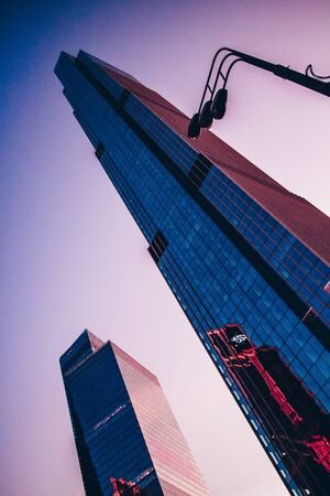 View of the tall skyscrapers. Skyscrapers on a sunset background.の写真素材