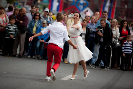 9 September 2014. Moscow, Russia. Festive parade near Red Square on Tverskaya street. Dancing people...