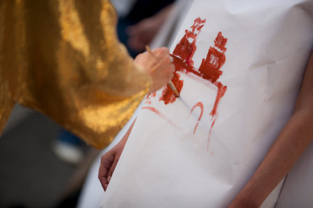 9 September 2014. Moscow, Russia. A festive day at Red Square on Tverskaya Street. The artist draws...