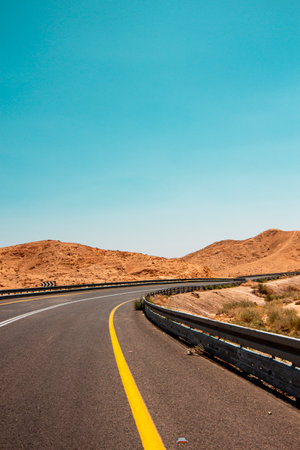Desert road among the mountains, view of the mountain landscape in the Judean Desert in southern Israel.の写真素材