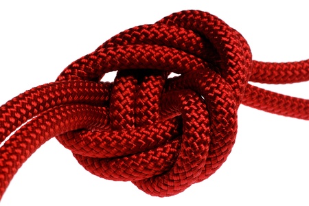 apocryphal knot on double red rope. isolated on white backgroundの写真素材
