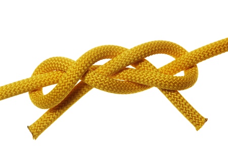 Dagger knot on yellow ropes. Isolated on white backgroundの写真素材