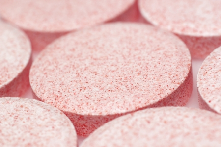 red vitamin pills background closeupの写真素材
