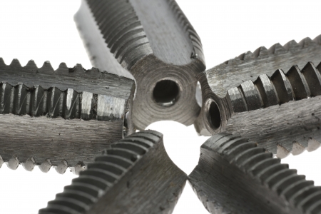 Five die tools composiotion  macro isolated on white backgroundの写真素材