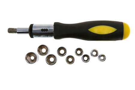 Yellow mechanical screwdriver with bits  isolated on white