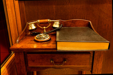 Ancient phone with phonebookの写真素材