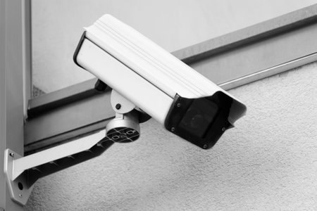 Security Camera Mounted on the Facade of the Building