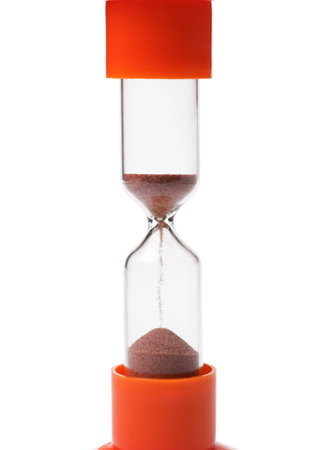 Orange hourglass isolated on white background.