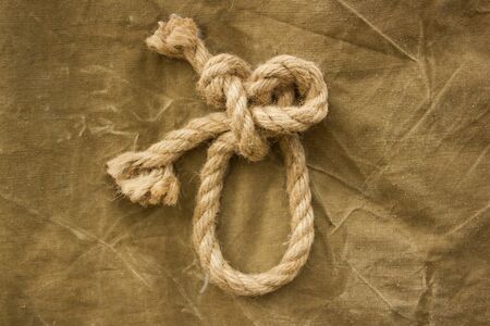 knot on khaki backgroundの写真素材