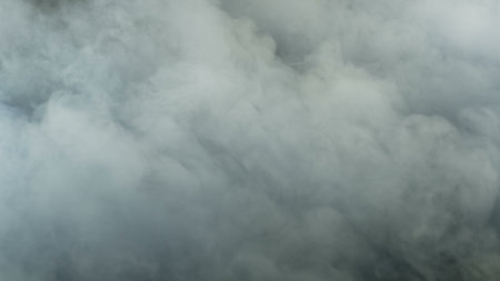 Photo of Realistic Clouds, Smoke, Dry Ice Smoke Texture on black dark Background. For website background, print wallpapers, logo, office or design element, posters and more.の写真素材