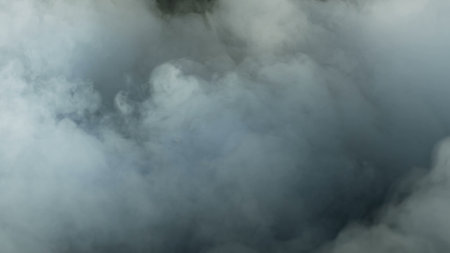 Photo of Realistic Clouds, Smoke, Dry Ice Smoke Texture on black dark Background. For website background, print wallpapers, logo, office or design element, posters and more.の写真素材