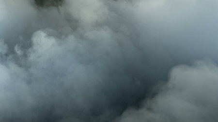 Photo of Realistic Clouds, Smoke, Dry Ice Smoke Texture on black dark Background. For website background, print wallpapers, office or design element, posters and more.の写真素材